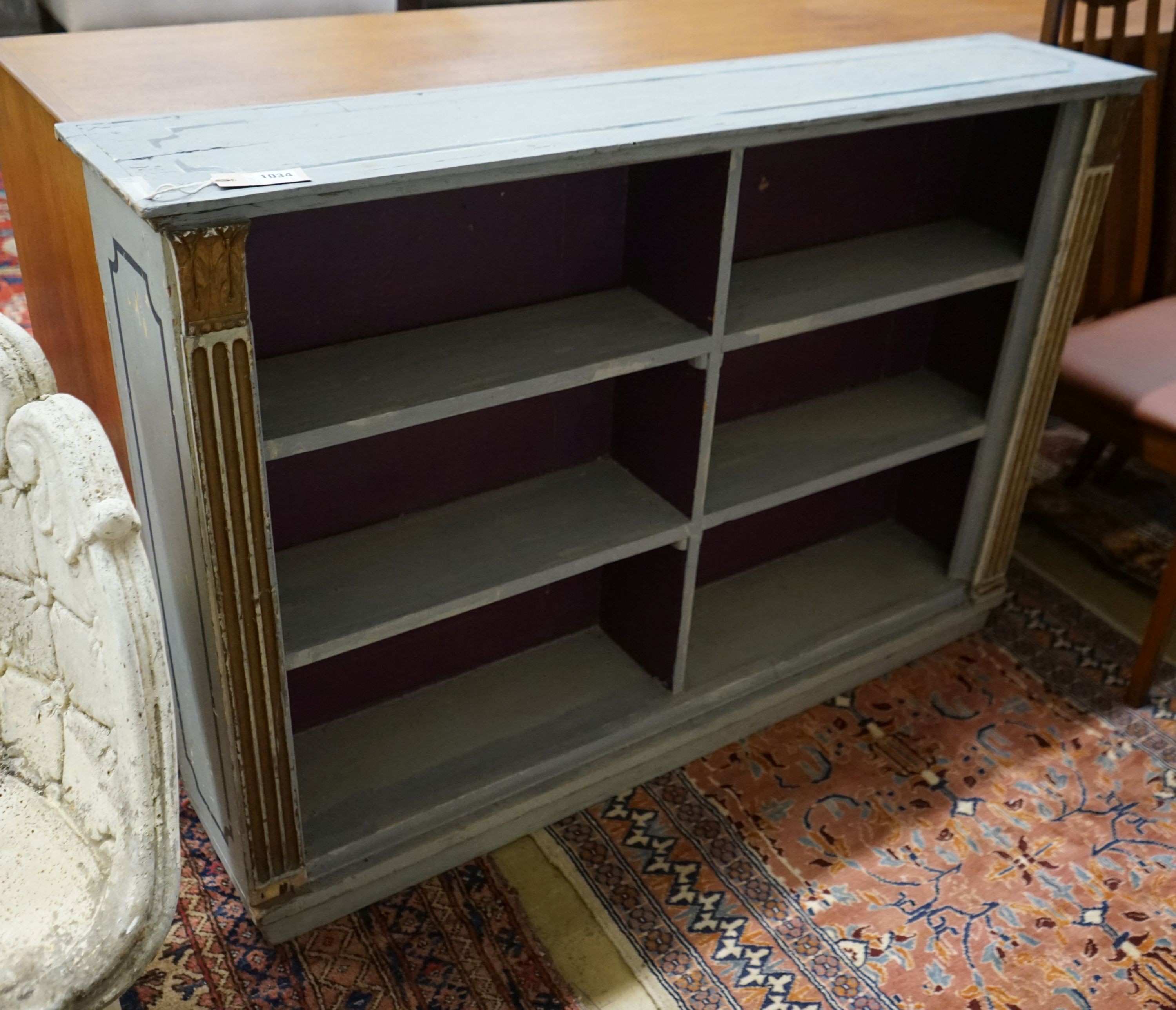 A blue painted pine open bookcase, width 120cm, depth 24cm, height 83cm